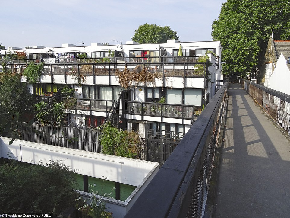 DUNBOYNE ROAD ESTATE, GOSPEL OAK: This Grade II listed estate, in north west London, was designed by Neave Brown and completed in 1977, the book reveals. The architect designed 'two of the most remarkable post-1965 council estates in London' - the above being one of them, the tome declares