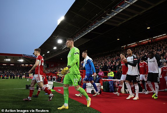 Soccer Football - Premier League - Nottingham Forest v Fulham - The City Ground, Nottingham, Britain - April 2, 2024 Fulham's Bernd Leno walks out onto the pitch before the match Action Images via Reuters/Andrew Boyers NO USE WITH UNAUTHORIZED AUDIO, VIDEO, DATA, FIXTURE LISTS, CLUB/LEAGUE LOGOS OR 'LIVE' SERVICES. ONLINE IN-MATCH USE LIMITED TO 45 IMAGES, NO VIDEO EMULATION. NO USE IN BETTING, GAMES OR SINGLE CLUB/LEAGUE/PLAYER PUBLICATIONS.