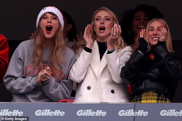 Pictured: Taylor, Brittany, and Ashley Avignone cheer after a Kansas City Chiefs touchdown in December
