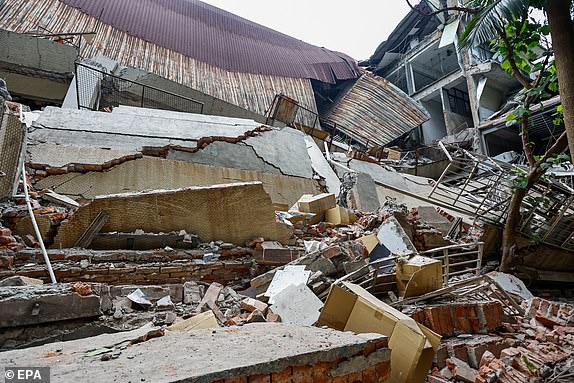 epa11256548 The wreckage of a printing company's factory after it collapsed following a magnitude 7.5 earthquake in New Taipei, Taiwan, 03 April 2024. A magnitude 7.4 earthquake struck Taiwan on the morning of 03 April with an epicenter 18 kilometers south of Hualien City at a depth of 34.8 km, according to the United States Geological Survey (USGS).  EPA/DANIEL CENG