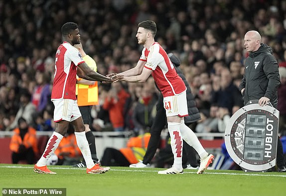Arsenal's Declan Rice (right) replaces Arsenal's Thomas Partey during the Premier League match at the Emirates Stadium, London. Picture date: Wednesday April 3, 2024. PA Photo. See PA story SOCCER Arsenal. Photo credit should read: Nick Potts/PA Wire.RESTRICTIONS: EDITORIAL USE ONLY No use with unauthorised audio, video, data, fixture lists, club/league logos or "live" services. Online in-match use limited to 120 images, no video emulation. No use in betting, games or single club/league/player publications.