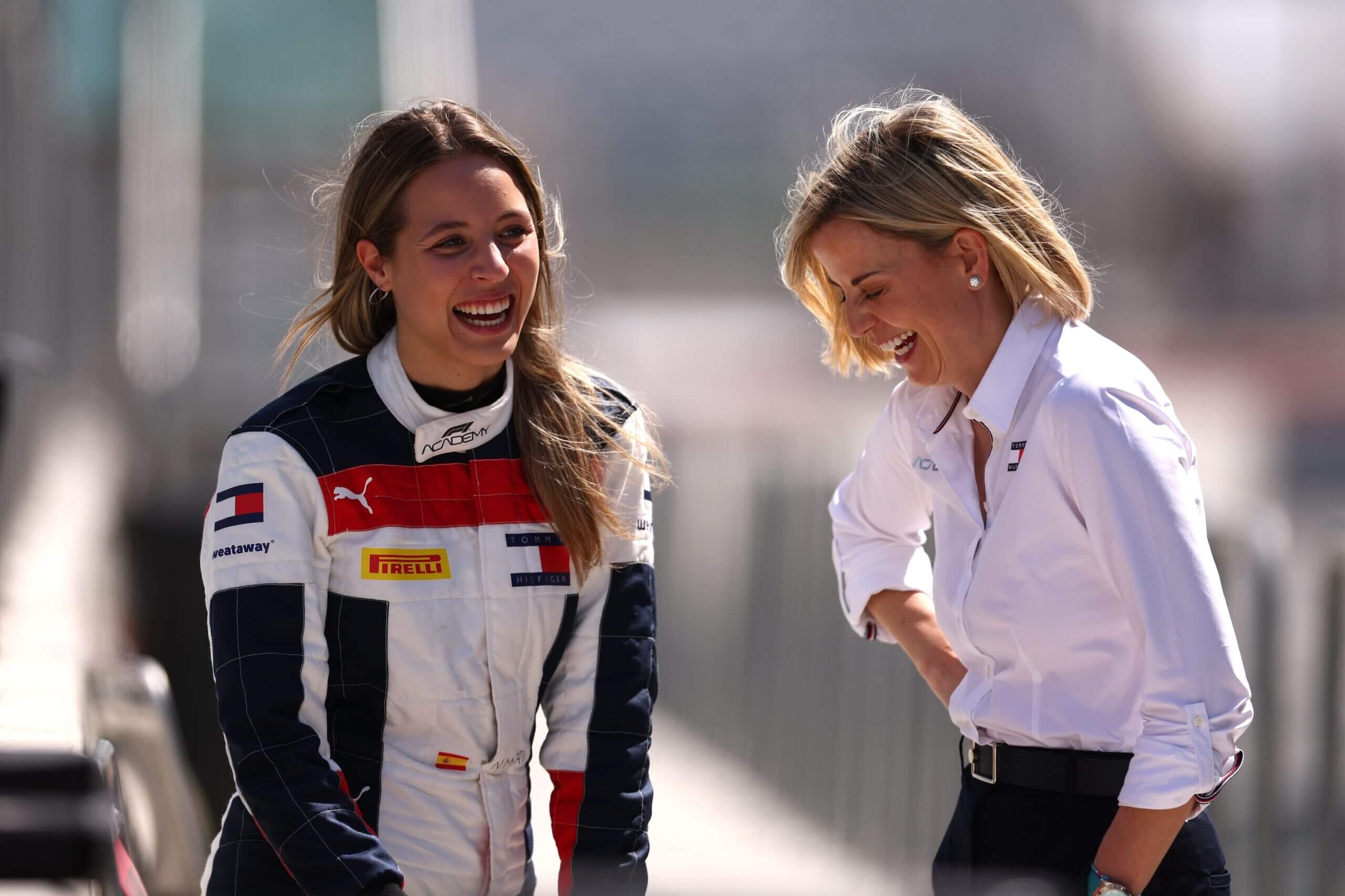 JEDDAH, SAUDI ARABIA - FEBRUARY 20: Nerea Marti of Spain and Campos Racing (30) shares a joke with Susie Wolff Managing Director of F1 Academy during F1 Academy Testing at Jeddah Corniche Circuit on February 20, 2024 in Jeddah, Saudi Arabia. (Photo by Alex Pantling - Formula 1/Formula 1 via Getty Images)