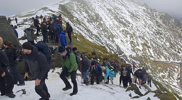 Lengthy queues of hikers headed up Wales's highest peak Snowdon over the Easter break