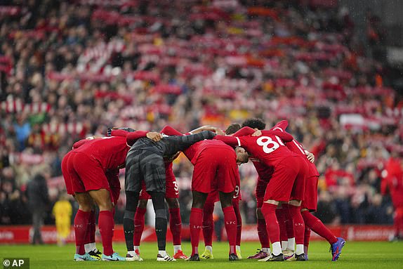 Liverpool team huddles just prior to kick off of the English Premier League soccer match between Liverpool and Sheffield United at the Anfield stadium in Liverpool, England, Thursday, Apr. 4, 2024. (AP Photo/Jon Super)