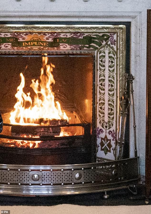 The room has an ornate fireplace, capable of producing a roaring fire in winter