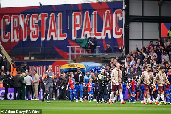 Manchester City and Crystal Palace players walk out before the Premier League match at Selhurst Park, London. Picture date: Saturday April 6, 2024. PA Photo. See PA story SOCCER Palace. Photo credit should read: Adam Davy/PA Wire.RESTRICTIONS: EDITORIAL USE ONLY No use with unauthorised audio, video, data, fixture lists, club/league logos or "live" services. Online in-match use limited to 120 images, no video emulation. No use in betting, games or single club/league/player publications.