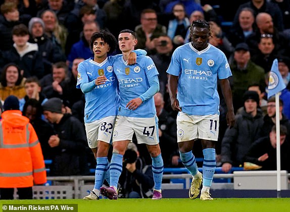 Manchester City's Phil Foden (centre) celebrates scoring their side's second goal of the game during the Premier League match at the Etihad Stadium, Manchester. Picture date: Wednesday April 3, 2024. PA Photo. See PA story SOCCER Man City. Photo credit should read: Martin Rickett/PA Wire.RESTRICTIONS: EDITORIAL USE ONLY No use with unauthorised audio, video, data, fixture lists, club/league logos or "live" services. Online in-match use limited to 120 images, no video emulation. No use in betting, games or single club/league/player publications.