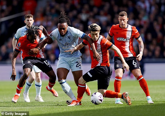 LUTON, ENGLAND - APRIL 06: Antoine Semenyo of AFC Bournemouth is challenged by Issa Kabore and Daiki Hashioka of Luton Town  during the Premier League match between Luton Town and AFC Bournemouth at Kenilworth Road on April 06, 2024 in Luton, England. (Photo by Paul Harding/Getty Images) (Photo by Paul Harding/Getty Images)