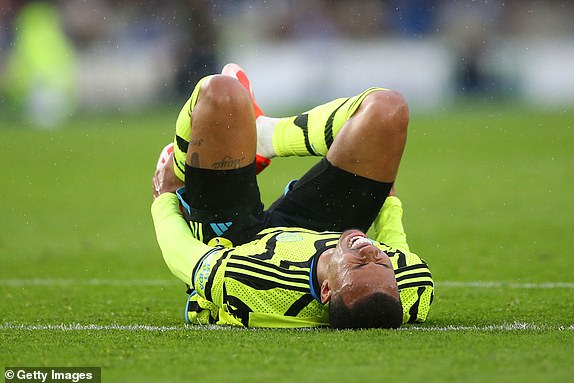 BRIGHTON, ENGLAND - APRIL 06: Gabriel of Arsenal goes down with an injury during the Premier League match between Brighton & Hove Albion and Arsenal FC at American Express Community Stadium on April 06, 2024 in Brighton, England. (Photo by Steve Bardens/Getty Images) (Photo by Steve Bardens/Getty Images)