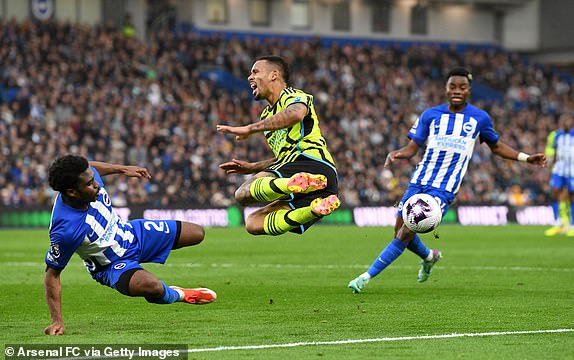 BRIGHTON, ENGLAND - APRIL 06: Gabriel Jesus of Arsenal is tackled by Tariq Lamptey of Brighton & Hove Albion during the Premier League match between Brighton & Hove Albion and Arsenal FC at American Express Community Stadium on April 06, 2024 in Brighton, England. (Photo by Stuart MacFarlane/Arsenal FC via Getty Images)