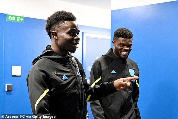BRIGHTON, ENGLAND - APRIL 06: Bukayo Saka and Thomas Partey of Arsenal arrive at the stadium prior to the Premier League match between Brighton & Hove Albion and Arsenal FC at American Express Community Stadium on April 06, 2024 in Brighton, England. (Photo by Stuart MacFarlane/Arsenal FC via Getty Images)
