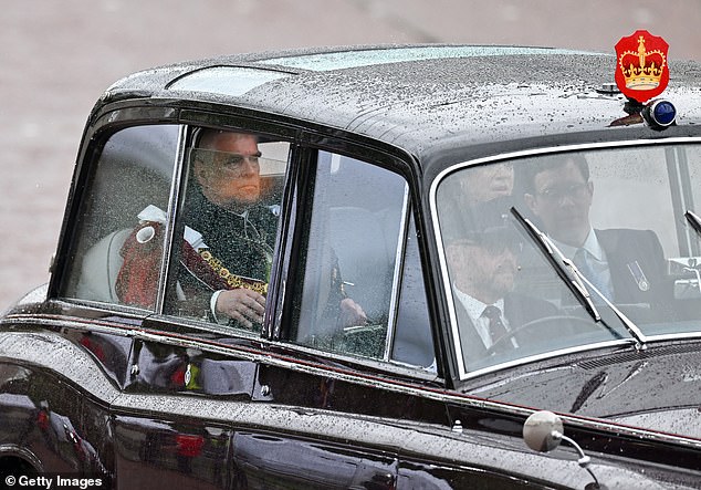 Prince Andrew, Duke of York can be seen travelling in the State Car during the Coronation of King Charles III and Queen Camilla on May 6, 2023