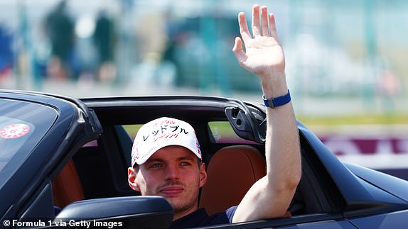 SUZUKA, JAPAN - APRIL 07: Max Verstappen of the Netherlands and Oracle Red Bull Racing waves to the crowd on the drivers parade prior to the F1 Grand Prix of Japan at Suzuka International Racing Course on April 07, 2024 in Suzuka, Japan. (Photo by Clive Rose - Formula 1/Formula 1 via Getty Images)