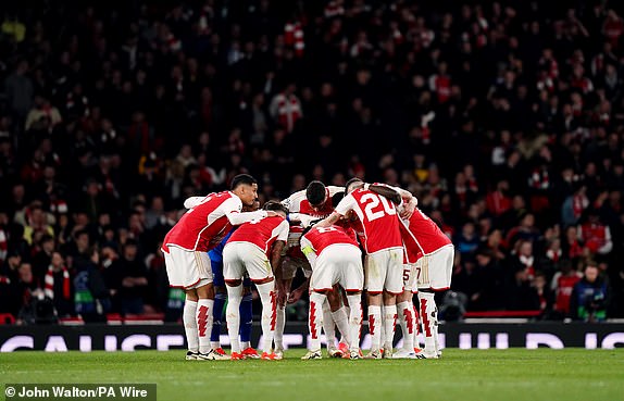 Arsenal players have a team huddle during the UEFA Champions League quarter-final, first leg match at the Emirates Stadium, London. Picture date: Tuesday April 9, 2024. PA Photo. See PA story SOCCER Arsenal. Photo credit should read: John Walton/PA Wire. RESTRICTIONS: Use subject to restrictions. Editorial use only, no commercial use without prior consent from rights holder.