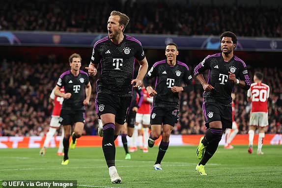LONDON, ENGLAND - APRIL 09: Harry Kane of Bayern Munich celebrates scoring his team's second goal from a penalty during the UEFA Champions League quarter-final first leg match between Arsenal FC and FC Bayern MÃ¼nchen at Emirates Stadium on April 09, 2024 in London, England. (Photo by Jan Kruger - UEFA/UEFA via Getty Images)