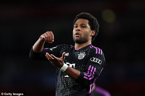 LONDON, ENGLAND - APRIL 9: Serge Gnabry of Bayern Munich celebrates after scoring a goal to make it 1-1 during the UEFA Champions League quarter-final first leg match between Arsenal FC and FC Bayern Munchen at Emirates Stadium on April 9, 2024 in London, England.(Photo by Catherine Ivill - AMA/Getty Images)