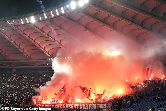 ROME, ITALY - FEBRUARY 14: The fans of Bayern Munich show their support as they wave flags and light pyrotechnics prior to kick-off ahead of the UEFA Champions League 2023/24 round of 16 first leg match between SS Lazio and FC Bayern MÃ¼nchen at Stadio Olimpico on February 14, 2024 in Rome, Italy. (Photo by S. Mellar/FC Bayern via Getty Images)