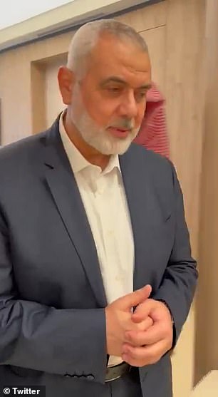 The Hamas chief nonchalantly responds: 'No, why? Let's continue,' as he walks to the door