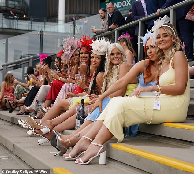Revellers sported colourful slim-fitting dresses, large fascinators and heels