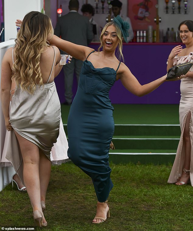 Women show off their moves on the dance floor as the drinks begin to flow at Aintree today