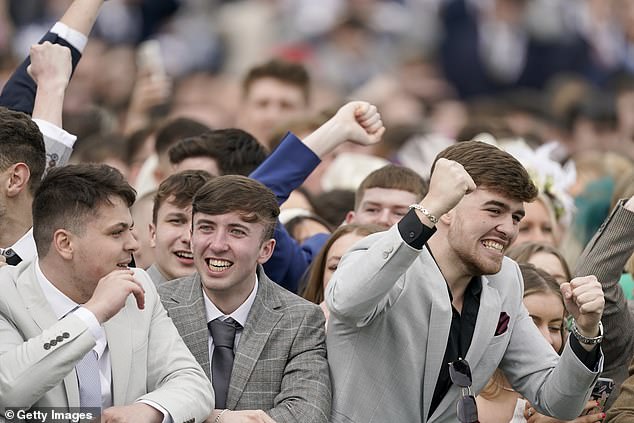 Smile! A group of well-dressed revellers react to the race