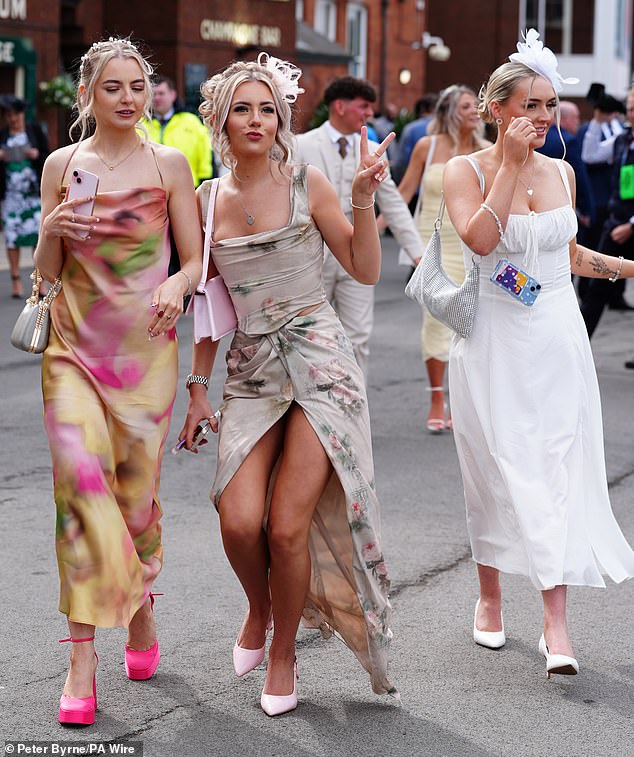 Racegoers opted to wear bright floral prints and classy heels as they put their best fashion foot forward for the event