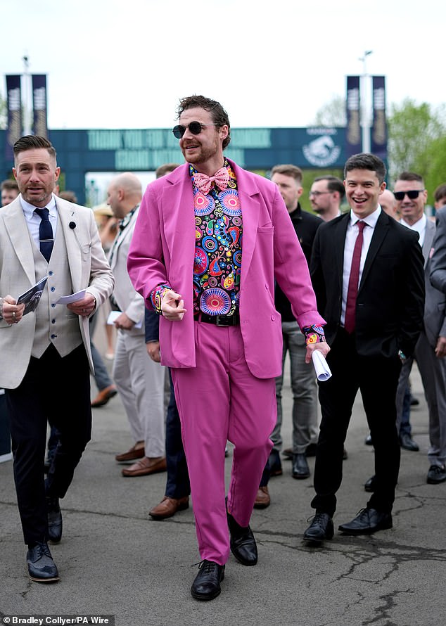 Real men wear pink! The men made sure the looks weren't only for women as they wowed in garish suits