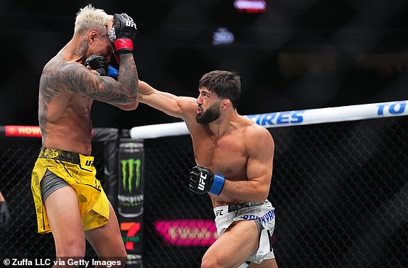 LAS VEGAS, NEVADA - APRIL 13: (R-L) Arman Tsarukyan of Georgia punches Charles Oliveira of Brazil in a lightweight fight during the UFC 300 event at T-Mobile Arena on April 13, 2024 in Las Vegas, Nevada.  (Photo by Chris Unger/Zuffa LLC via Getty Images)