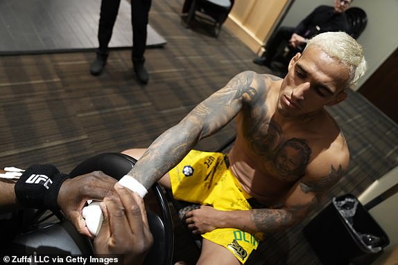 LAS VEGAS, NEVADA - APRIL 13: Charles Oliveira of Brazil has his hands wrapped prior to his fight during the UFC 300 event at T-Mobile Arena on April 13, 2024 in Las Vegas, Nevada.  (Photo by Mike Roach/Zuffa LLC via Getty Images)