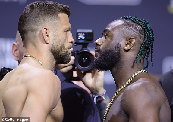 LAS VEGAS, NEVADA - APRIL 12: (L-R) Opponents Calvin Kattar and Aljamain Sterling face off during the UFC 300 ceremonial weigh-in at MGM Grand Garden Arena on April 12, 2024 in Las Vegas, Nevada. (Photo by Carmen Mandato/Getty Images)