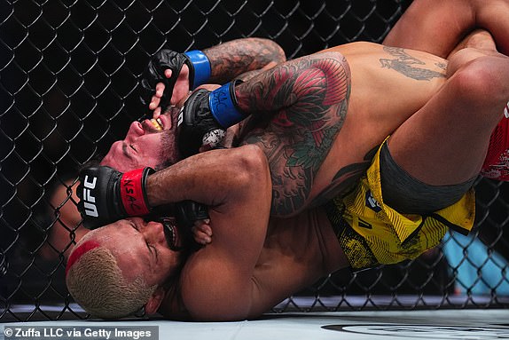 LAS VEGAS, NEVADA - APRIL 13: (L-R) Deiveson Figueiredo of Brazil wrestles Cody Garbrandt in a bantamweight fight during the UFC 300 event at T-Mobile Arena on April 13, 2024 in Las Vegas, Nevada.  (Photo by Chris Unger/Zuffa LLC via Getty Images)