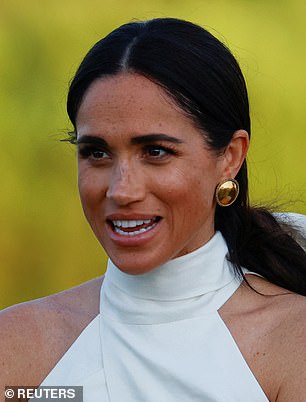 Meghan had her hair pulled back in a low ponytail, and she removed her sunglasses as the evening wore on and the sun set