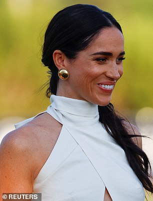 Meghan had her hair pulled back in a low ponytail, and she removed her sunglasses as the evening wore on and the sun set