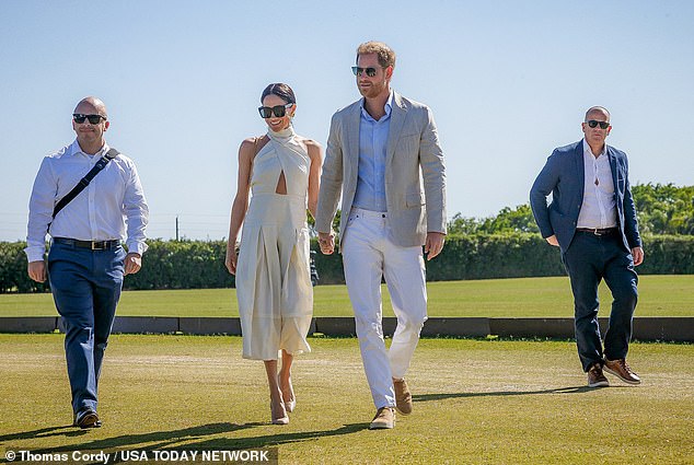 The duo were flanked by burly security guards as they made their way into the event, which is being held at a polo club in Wellington, Florida, near Palm Beach