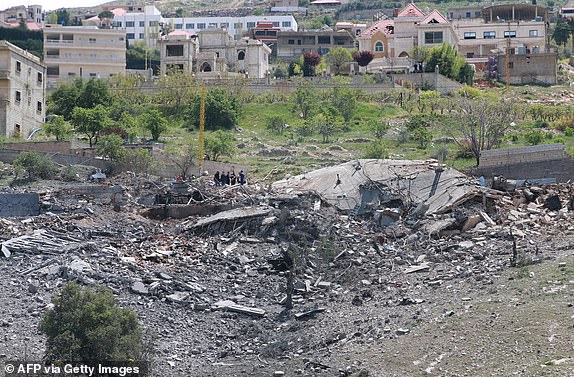 A general view shows a destroyed building targeted by Israeli air strikes on the village of Nabi Sheet in the Baablbek district in Lebanon's eastern Bekaa Valley on April 14, 2024, as tensions in the region soared after Iran directly attacked Israel. A source within Lebanon's Iran-backed Hezbollah group said Israel struck on April 14 one of its buildings in Lebanon's east, close to the Syrian border, as tensions soared after Iran directly attacked Israel. The Lebanese state-run National News Agency also reported that "an enemy air strike targeted a building" in the village of Nabi Sheet and "destroyed it". (Photo by AFP) (Photo by -/AFP via Getty Images)