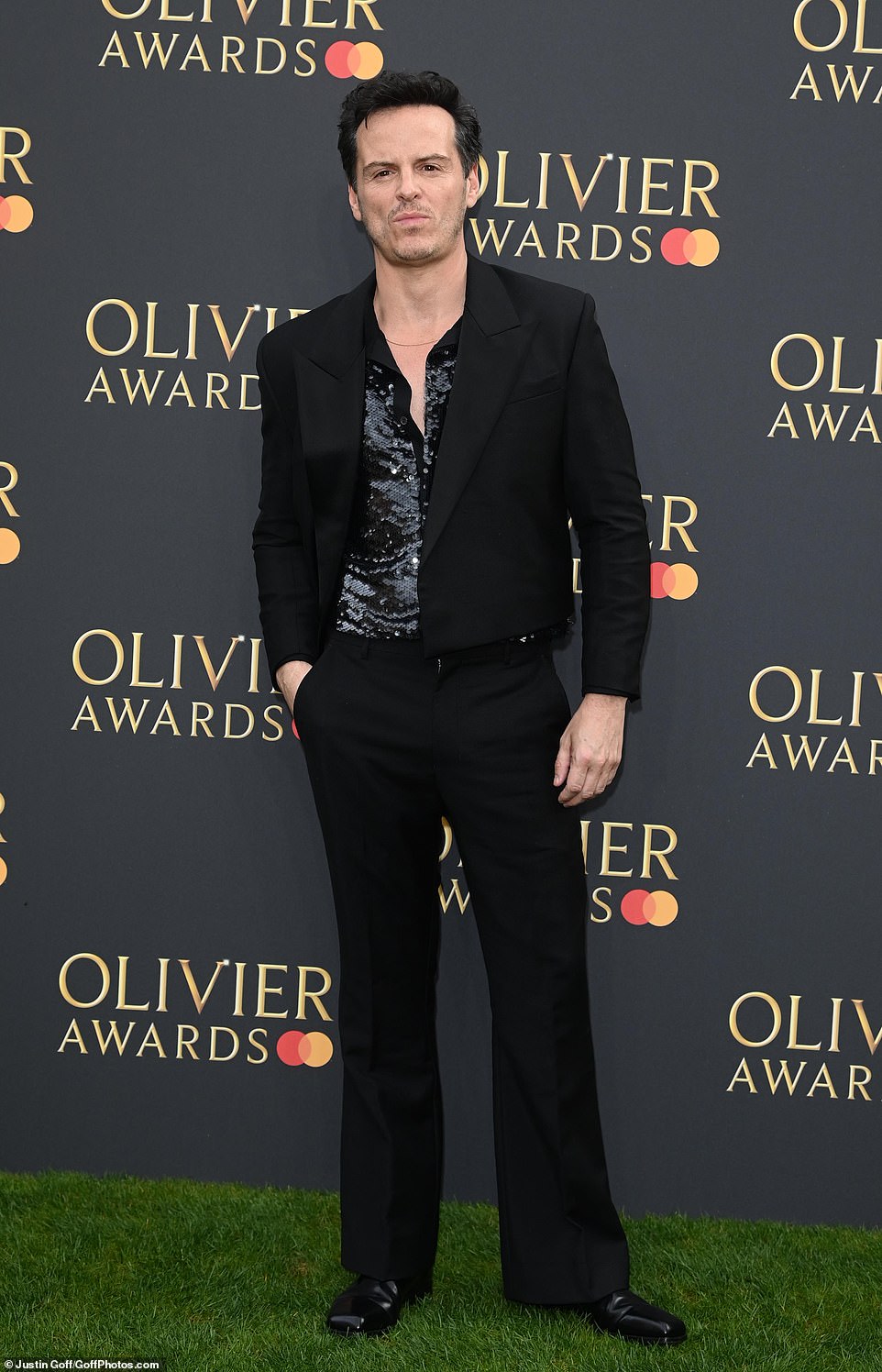 Andrew Scott made a debonair arrival in a black cropped blazer over an eye-catching sequinned shirt