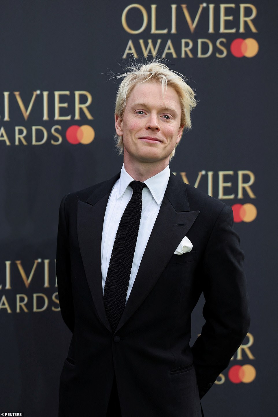 Freddie Fox opted for a classic black tuxedo with a cream satin pocket square, but elevated the look by adding a sequinned black tie