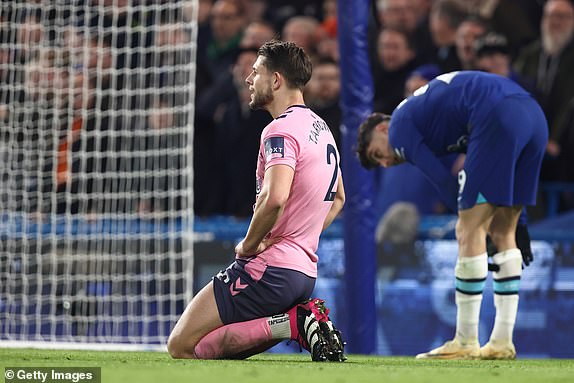 LONDON, ENGLAND - MARCH 18: James Tarkowski of Everton reacts after giving away a penalty during the Premier League match between Chelsea FC and Everton FC at Stamford Bridge on March 18, 2023 in London, United Kingdom. (Photo by James Williamson - AMA/Getty Images)