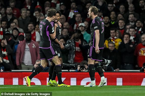 LONDON, ENGLAND - APRIL 9: Serge Gnabry (C) of Bayern Muenchen celebrates with teammates Leon Goretzka (L) and Harry Kane after scoring his team's first goal during the UEFA Champions League quarter-final first-leg match between Arsenal FC and FC Bayern MÃ¼nchen at Emirates Stadium on April 9, 2024 in London, United Kingdom. (Photo by Vincent Mignott/DeFodi Images via Getty Images)