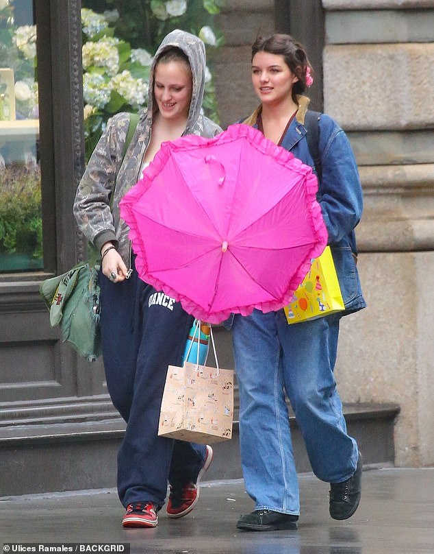 The pair appeared to be in high spirits despite the kiserable weather during their outing