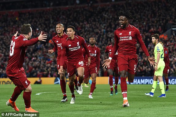 Liverpool's Belgian striker Divock Origi (R) celebrates after scoring their fourth goal during the UEFA Champions league semi-final second leg football match between Liverpool and Barcelona at Anfield in Liverpool, north west England on May 7, 2019. (Photo by Paul ELLIS / AFP)PAUL ELLIS/AFP/Getty Images