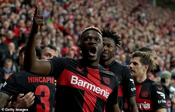 LEVERKUSEN, GERMANY - APRIL 11: Victor Boniface of Bayer Leverkusen celebrates with team mates after scoring his teams second goal during the UEFA Europa League 2023/24 Quarter-Final first leg match between Bayer 04 Leverkusen and West Ham United FC at BayArena on April 11, 2024 in Leverkusen, Germany. (Photo by Lars Baron/Getty Images) (Photo by Lars Baron/Getty Images)
