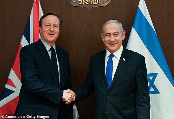 JERUSALEM - APRIL 17: (----EDITORIAL USE ONLY - MANDATORY CREDIT - 'ISRAELI GOVERNMENT PRESS OFFICE (GPO) / HANDOUT' - NO MARKETING NO ADVERTISING CAMPAIGNS - DISTRIBUTED AS A SERVICE TO CLIENTS, DO NOT OBSCURE LOGO----) Israeli Prime Minister Benjamin Netanyahu welcomes UK Foreign Secretary David Cameron during his official visit in West Jerusalem on April 17, 2024. (Photo by Israeli Government Press Office / Handout/Anadolu via Getty Images)