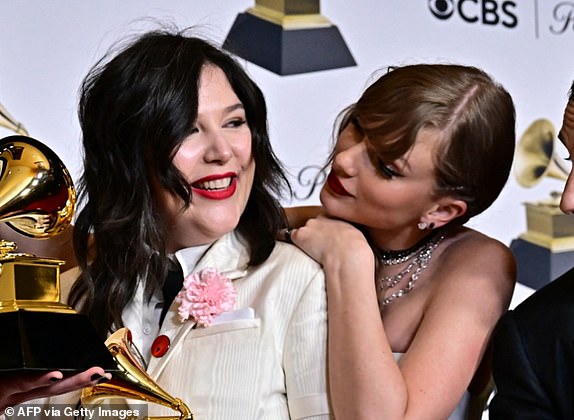 US singer-songwriter Taylor Swift winner of Best Pop Vocal Album and Album of the Year for "Midnights" poses with Julien Baker, Phoebe Bridgers, Lucy Dacus of US indie group boygenius hoding the Grammy Awards for Best Alternative Music Album for "The Record", Best Rock Song for "Not Strong Enough" and Best Rock Performance for "Not Strong Enough" with singer Jack Antonoff (R) during the 66th Annual Grammy Awards at the Crypto.com Arena in Los Angeles on February 4. (Photo by Frederic J. Brown / AFP) (Photo by FREDERIC J. BROWN/AFP via Getty Images)