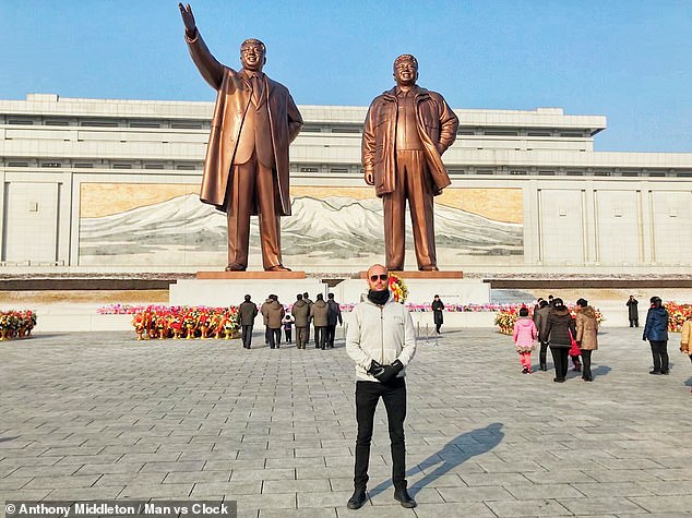 Statues and monuments commemorating the Kim family's leadership are a common sight throughout North Korea, said Anthony, who is pictured above at the Mansu Hill Grand Monument in Pyongyang