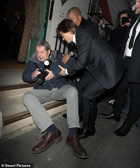 As crowds gathered outside the swanky club the actor found himself tumbling into a waiting photographer