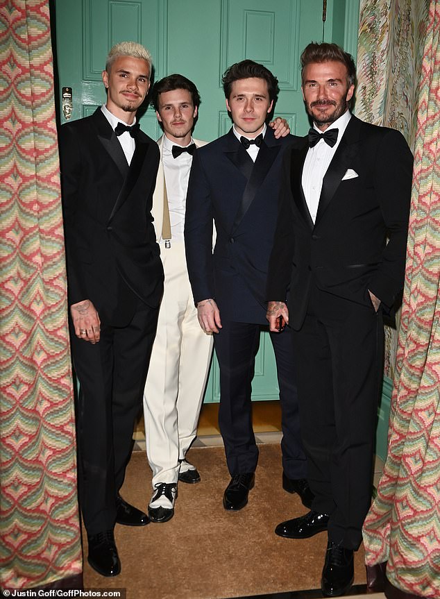 Earlier that night David posed for a group shot with his three sons (left-right: Romeo, Cruz, Brooklyn and David Beckham)