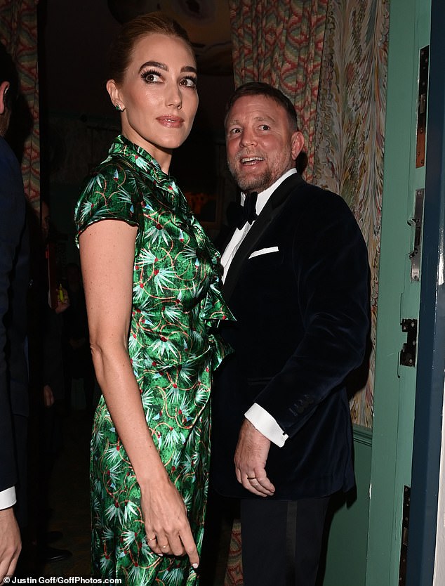 Guy Ritchie and Jacqui Ainsley were all smiles as they made their way into Oswald's on Saturday night