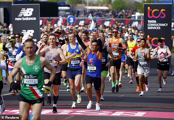 Athletics - London Marathon - London, Britain - April 21, 2024  Muhit Rahman and Richard Hunter in action during the marathon REUTERS/John Sibley