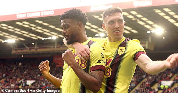 SHEFFIELD, ENGLAND - APRIL 20: Burnley's Lyle Foster (left) celebrates scoring his side's third goal with team-mate  Dara O'Shea during the Premier League match between Sheffield United and Burnley FC at Bramall Lane on April 20, 2024 in Sheffield, England.(Photo by Rich Linley - CameraSport via Getty Images)